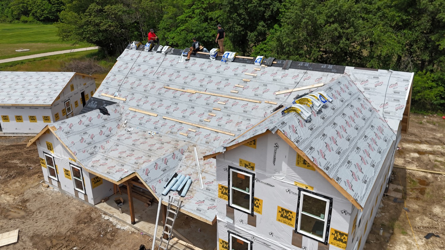 SID Roofing crew working on roof installation in Greene County IN