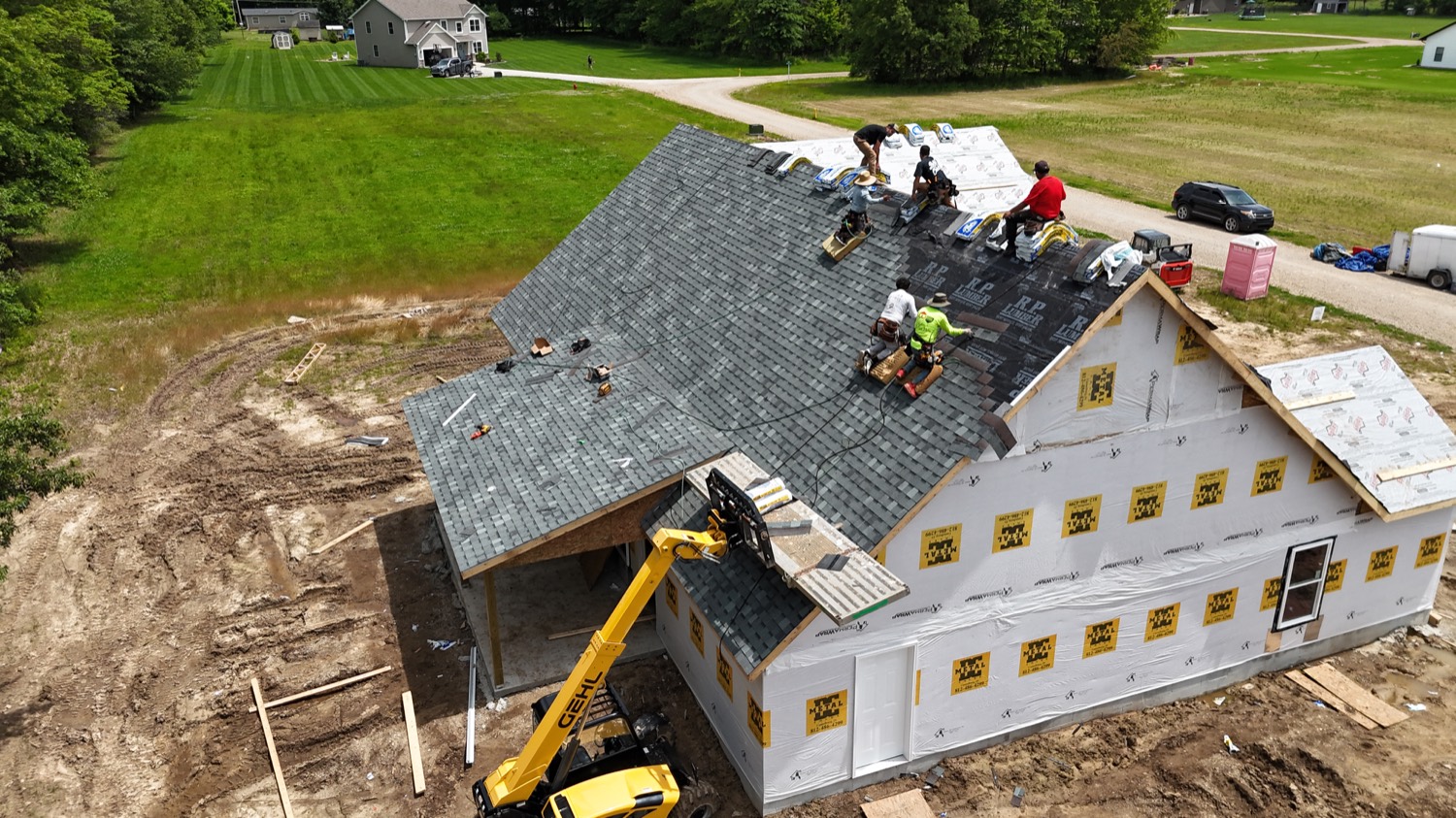 Roof replacement contractor installing shingles in Greene County IN