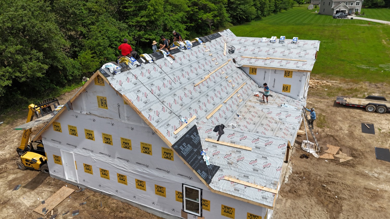 Roofing crew installing shingles in Greene County IN